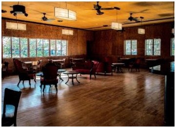 After: another view of the completed lounge on the second floor showing the refinished original floor